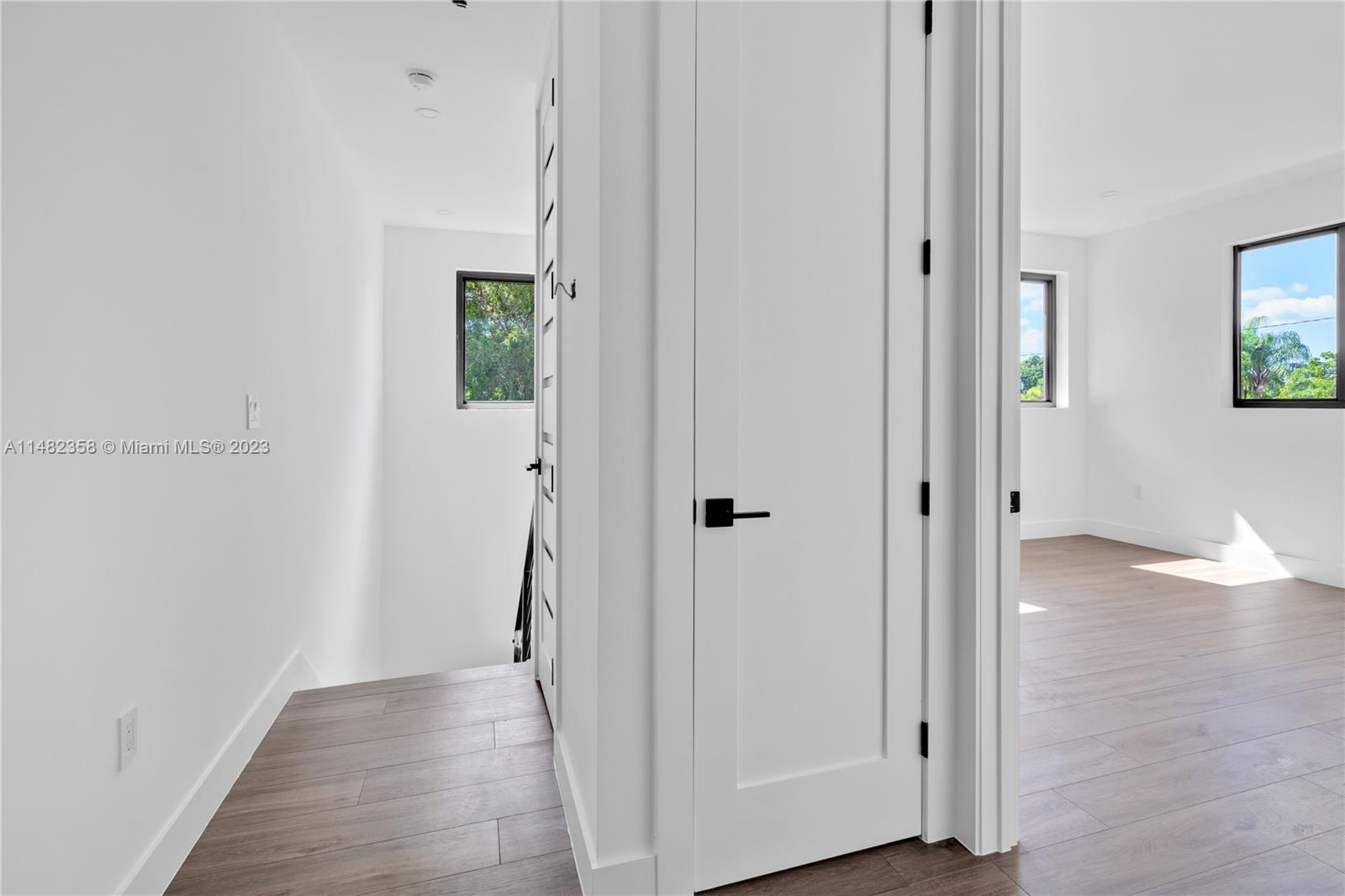 5241 Southwest 6th Street Miami, FL 33134 - Photo 26 of 38 a view of hallway with wooden floor