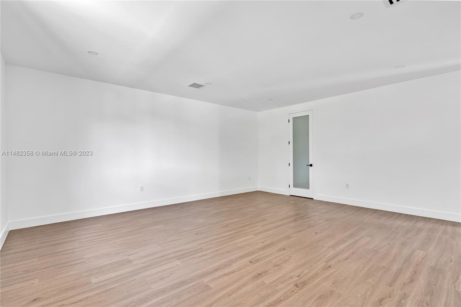 5241 Southwest 6th Street Miami, FL 33134 - Photo 32 of 38 a view of an empty room with wooden floor