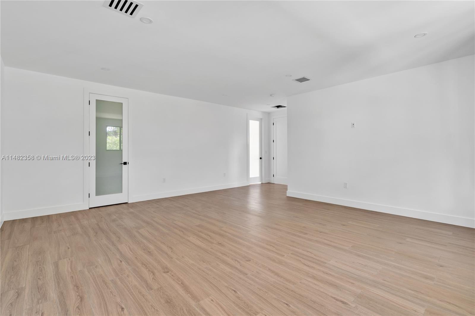 5241 Southwest 6th Street Miami, FL 33134 - Photo 33 of 38 a view of an empty room with wooden floor