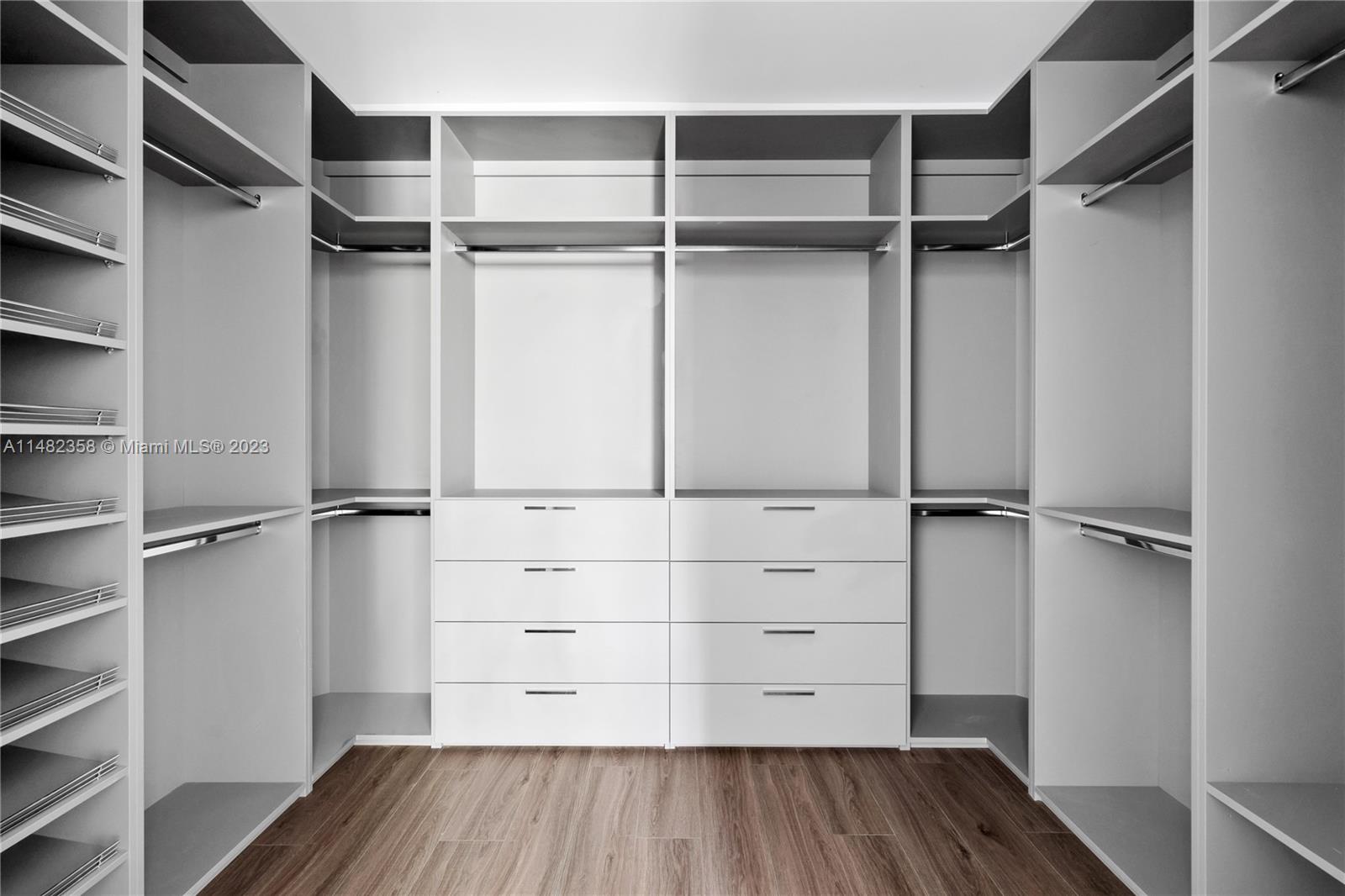 5241 Southwest 6th Street Miami, FL 33134 - Photo 35 of 38 a view of walk in closet with empty racks