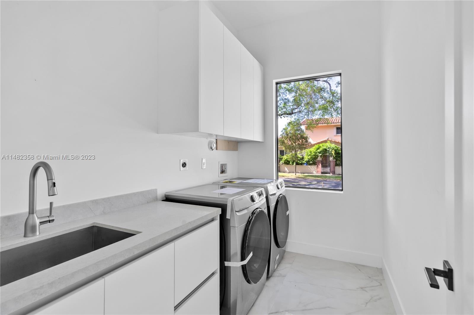 5241 Southwest 6th Street Miami, FL 33134 - Photo 9 of 38 a view of a kitchen with appliances and a window