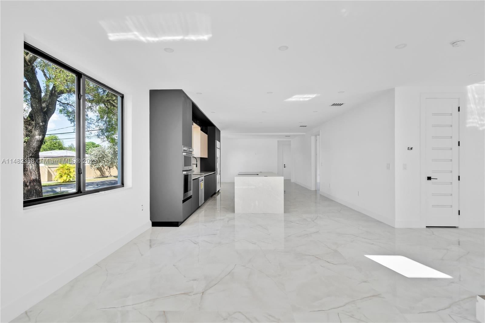 5241 Southwest 6th Street Miami, FL 33134 - Photo 10 of 38 a view of a kitchen with furniture and windows