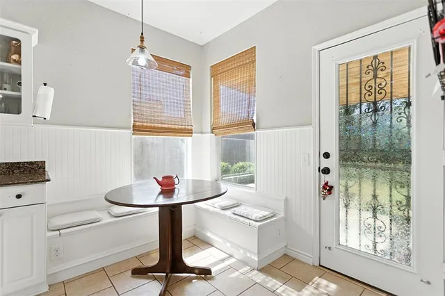 a living room with kitchen island furniture and a window