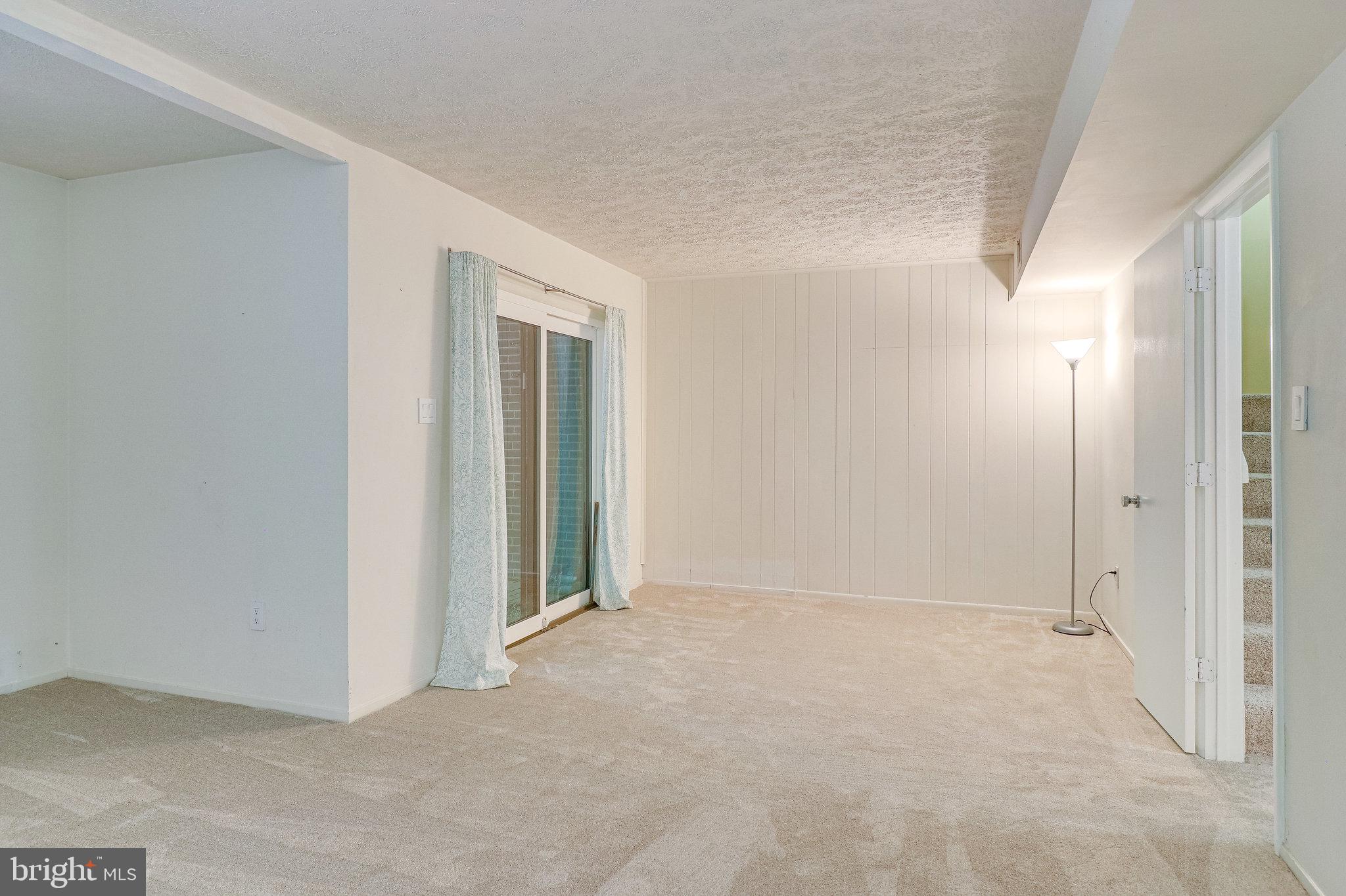 2210 Glencourse Lane Reston, VA 20191 - Photo 56 of 84 View of Rec Room Sliding Glass Door & Staircase