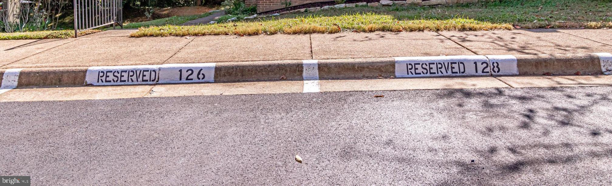 2210 Glencourse Lane Reston, VA 20191 - Photo 80 of 84 Two Assigned Parking Spaces against the sidewalk