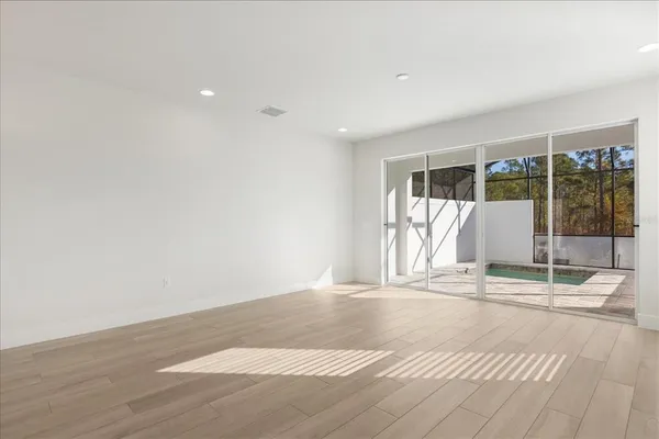 a view of a kitchen with a sink and a window
