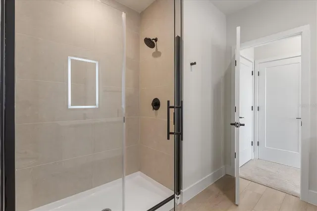 a bathroom with a double vanity sink and a mirror
