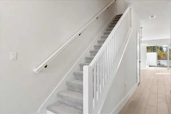 a kitchen with appliances a sink and a refrigerator