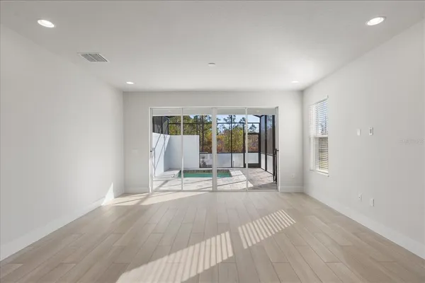 a kitchen with granite countertop a sink and a wooden floor