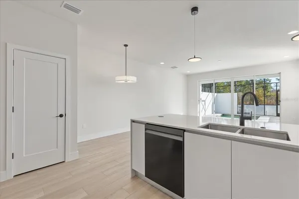 a kitchen with a sink stove and microwave
