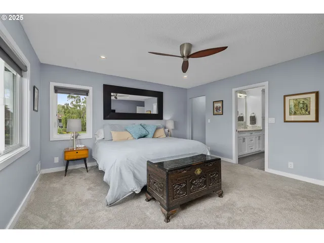 a bed room with a bed window and couch