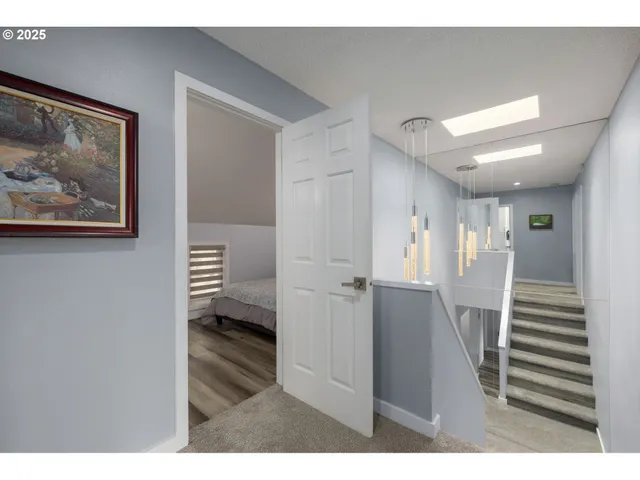 a view of entryway with stairs and wooden floor
