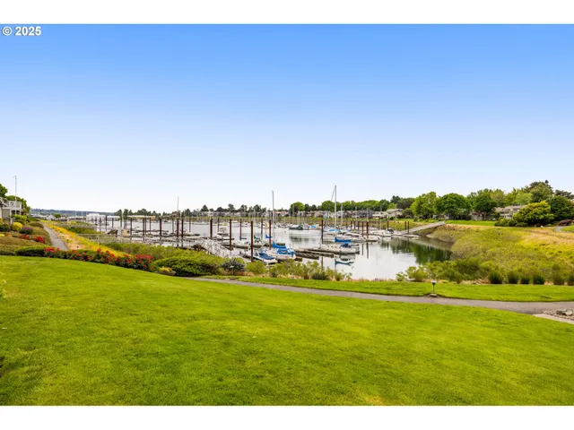 a view of a lake with houses in the background