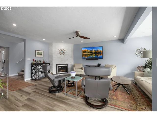 a living room with a couch and a fireplace