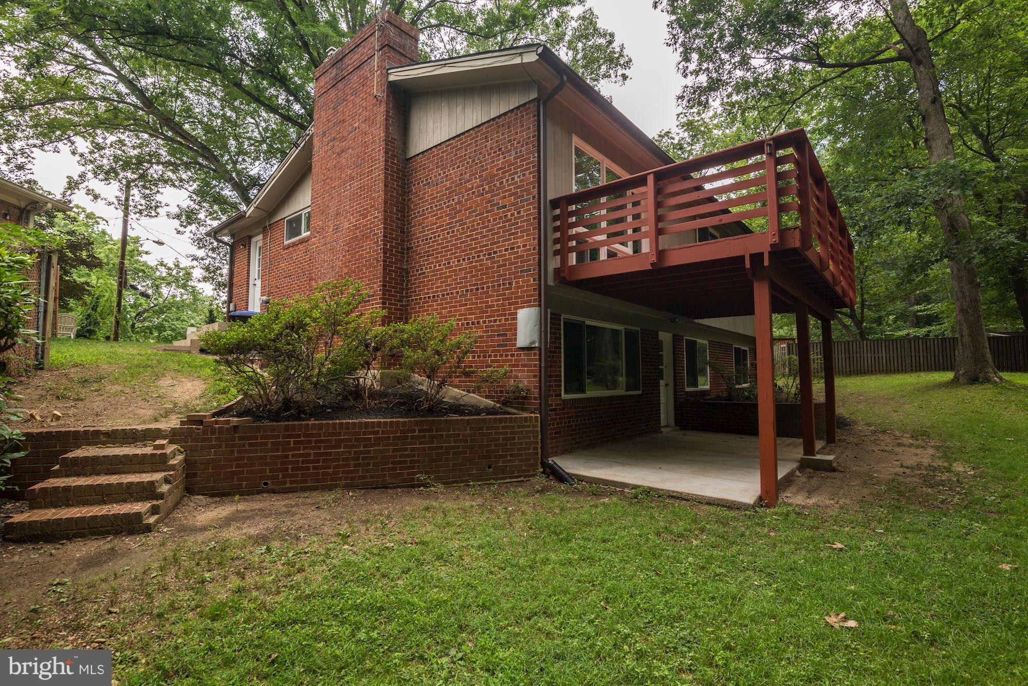 10709 Glenwild Road Silver Spring, MD 20901 - Photo 27 of 30 a view of a house with a yard and tree s
