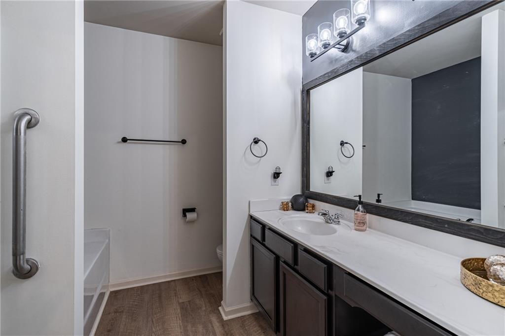 723 Independence Avenue Pendergrass, GA 30567 - Photo 12 of 22 a bathroom with a double vanity sink a and mirror