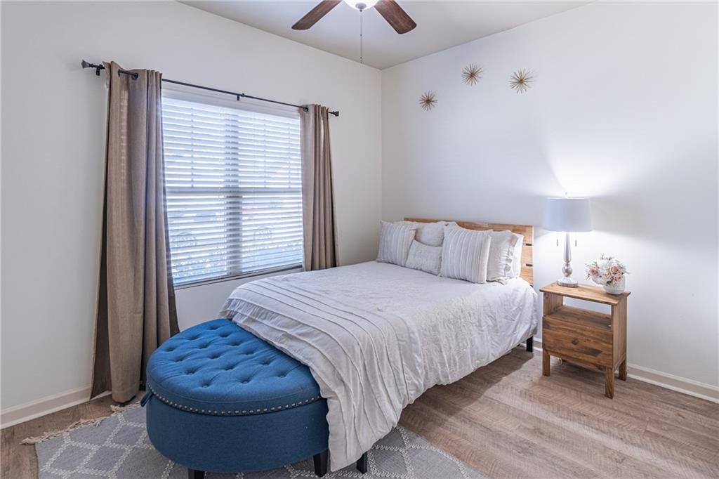 723 Independence Avenue Pendergrass, GA 30567 - Photo 13 of 22 a bedroom with a bed and a chandelier