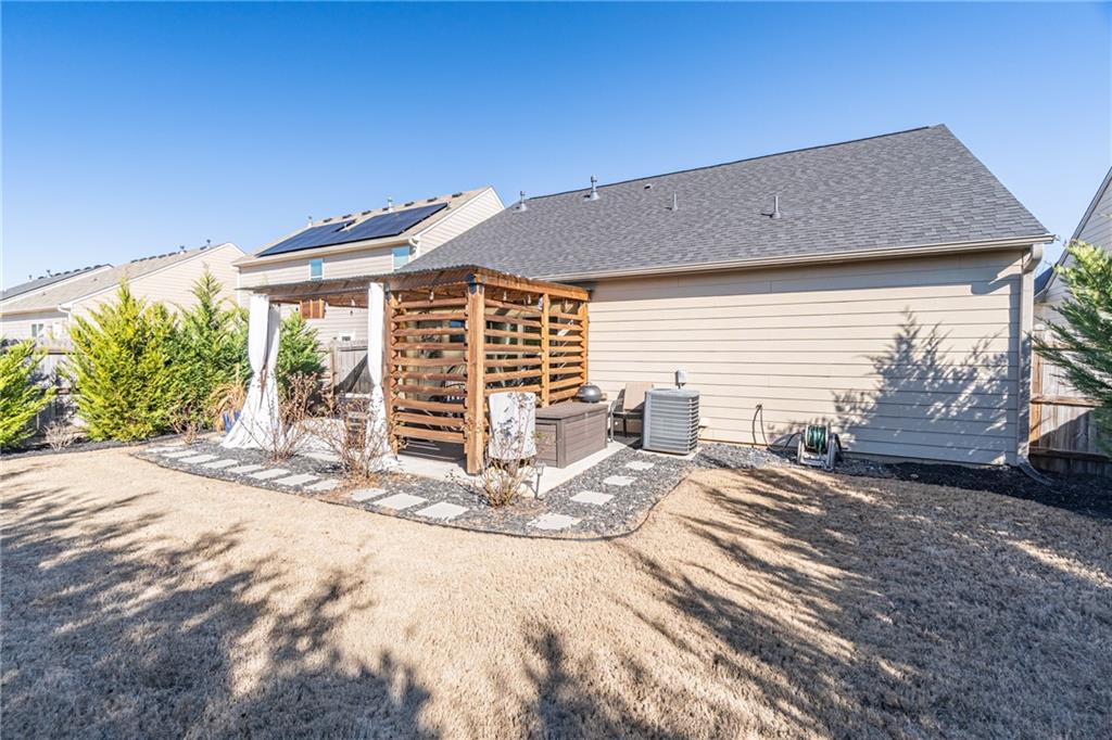 723 Independence Avenue Pendergrass, GA 30567 - Photo 19 of 22 a view of a backyard with a patio