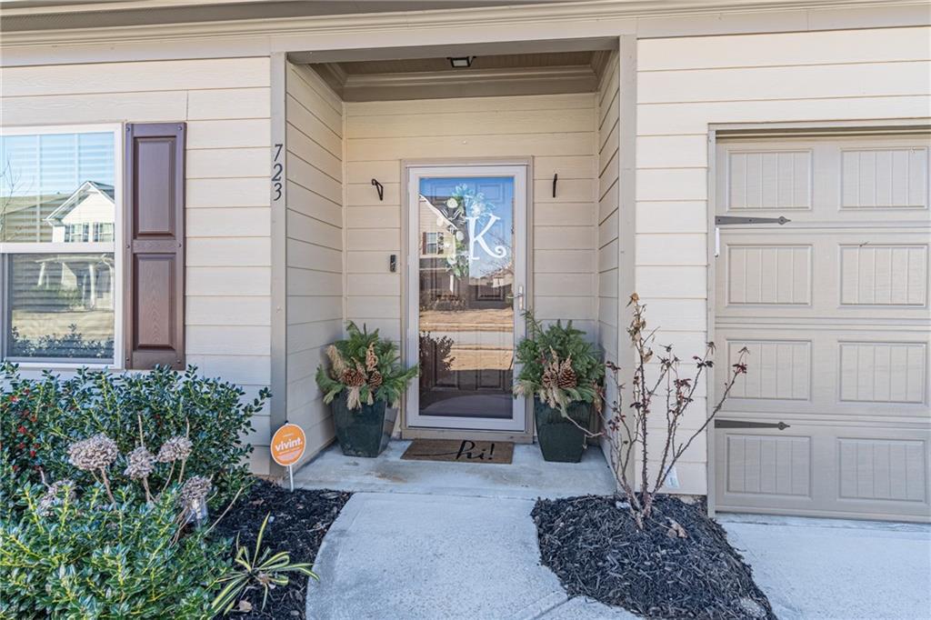 723 Independence Avenue Pendergrass, GA 30567 - Photo 2 of 22 a front view of a house with garden