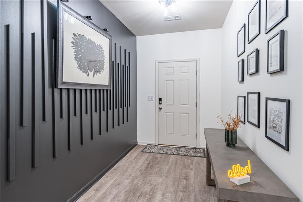723 Independence Avenue Pendergrass, GA 30567 - Photo 3 of 22 a view of an entryway with wooden floor