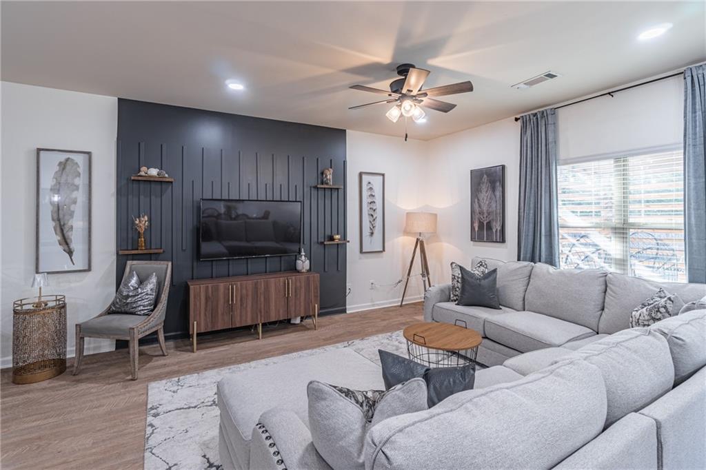 723 Independence Avenue Pendergrass, GA 30567 - Photo 5 of 22 a living room with furniture and a flat screen tv