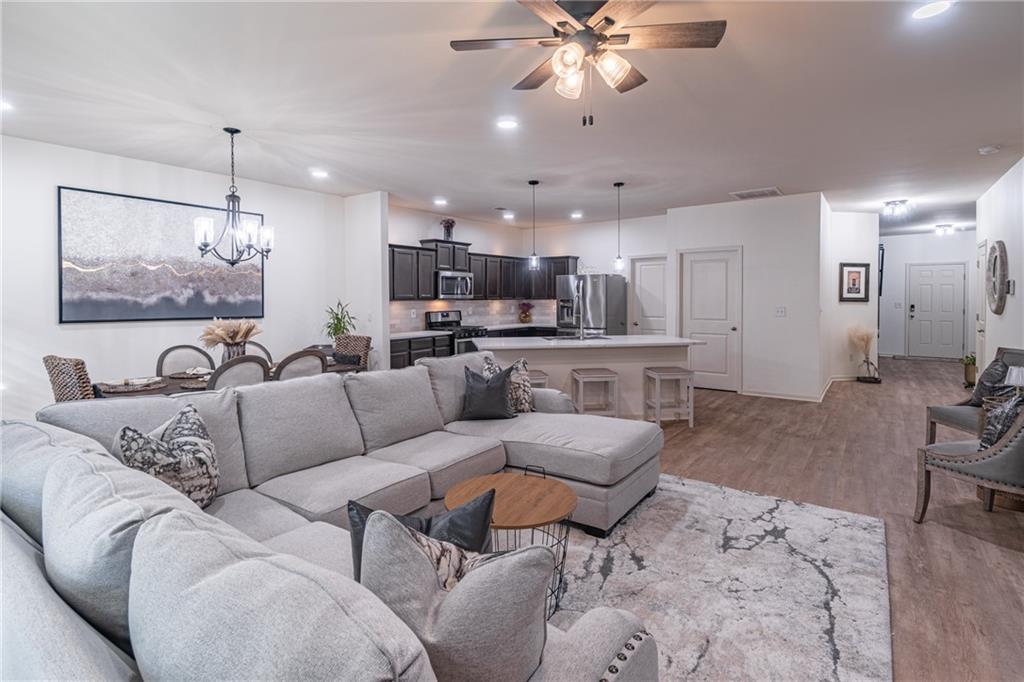 723 Independence Avenue Pendergrass, GA 30567 - Photo 6 of 22 a living room with furniture and kitchen view