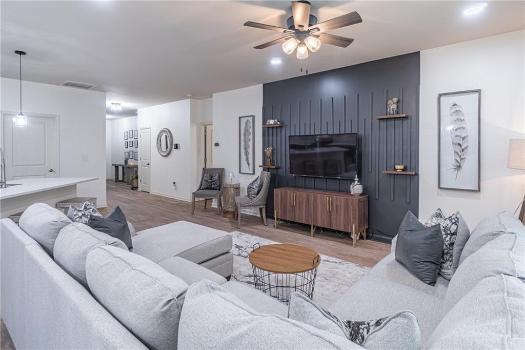 723 Independence Avenue Pendergrass, GA 30567 - Photo 7 of 22 a living room with furniture and a flat screen tv