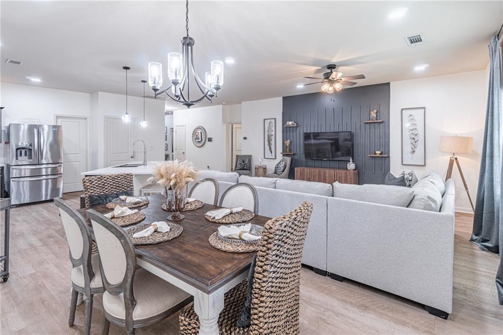 723 Independence Avenue Pendergrass, GA 30567 - Photo 10 of 22 a large kitchen with a table and chairs