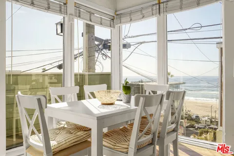 a view of an outdoor dining space with furniture