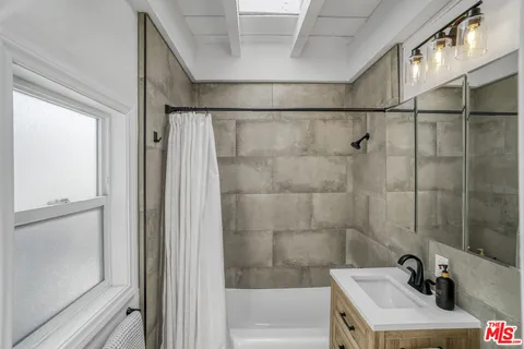 a view of a balcony with a potted plant