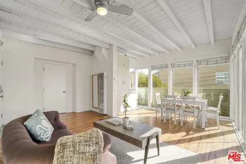 a view of a balcony with wooden floor