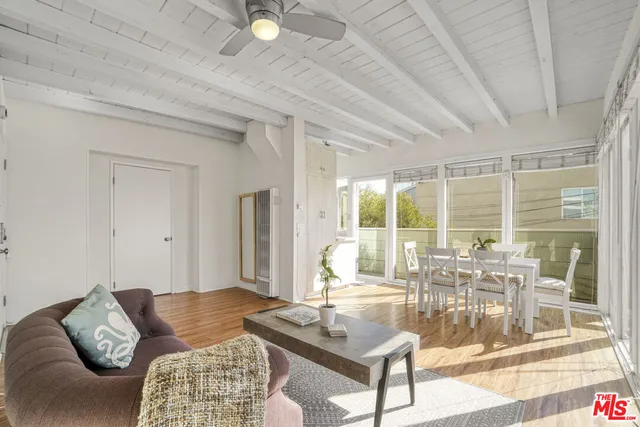 a view of a balcony with wooden floor