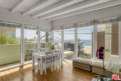 a dining room with a table and chairs
