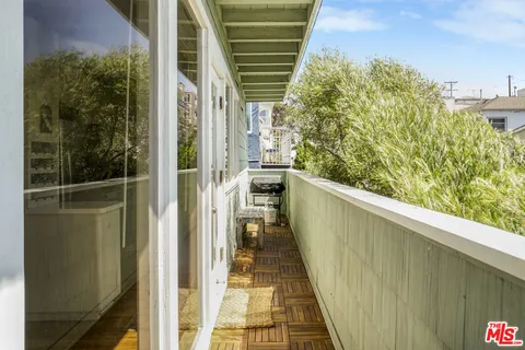 a view of balcony with a potted plant