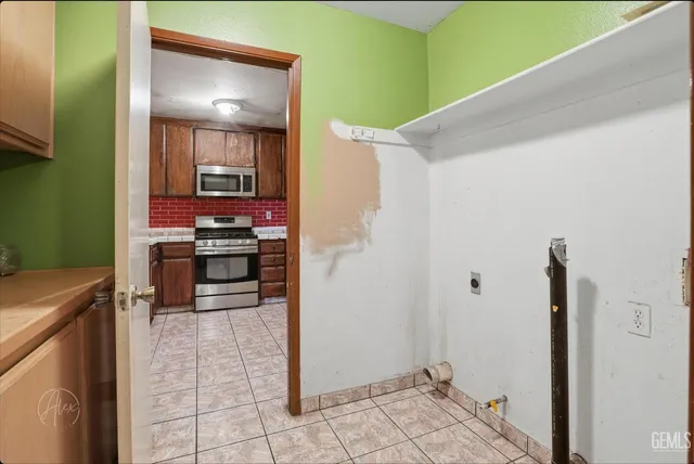 a kitchen with cabinets and a wooden floor