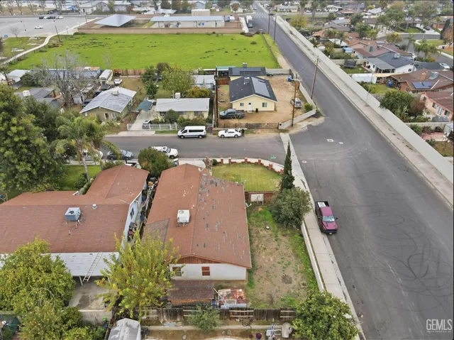 an aerial view of a house with outdoor space