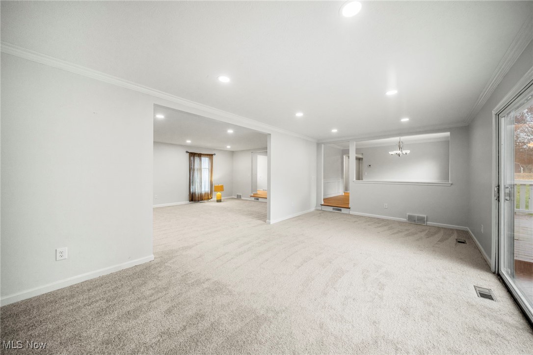 91 Paradise Road Painesville, OH 44077 - Photo 14 of 39 Basement featuring crown molding, recessed lighting, and light carpet