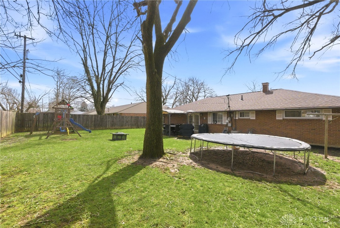 5171 Fishburg Road Dayton, OH 45424 - Photo 33 of 35 This spacious backyard offers a perfect setting for relaxation and outdoor activities.