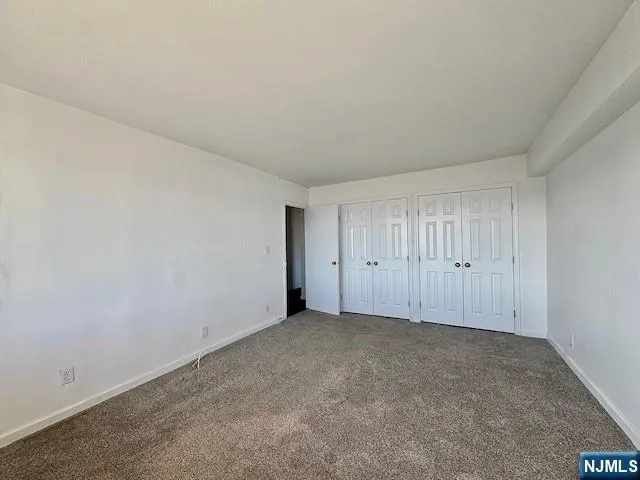 a view of an empty room and entryway