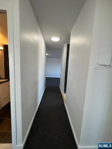 a view of hallway with stairs