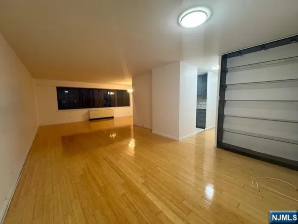 a large kitchen with stainless steel appliances granite countertop a sink and cabinets