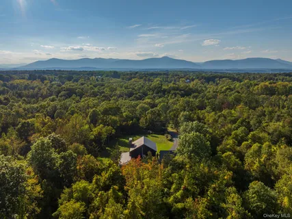 a view of a mountain with a lake in the background