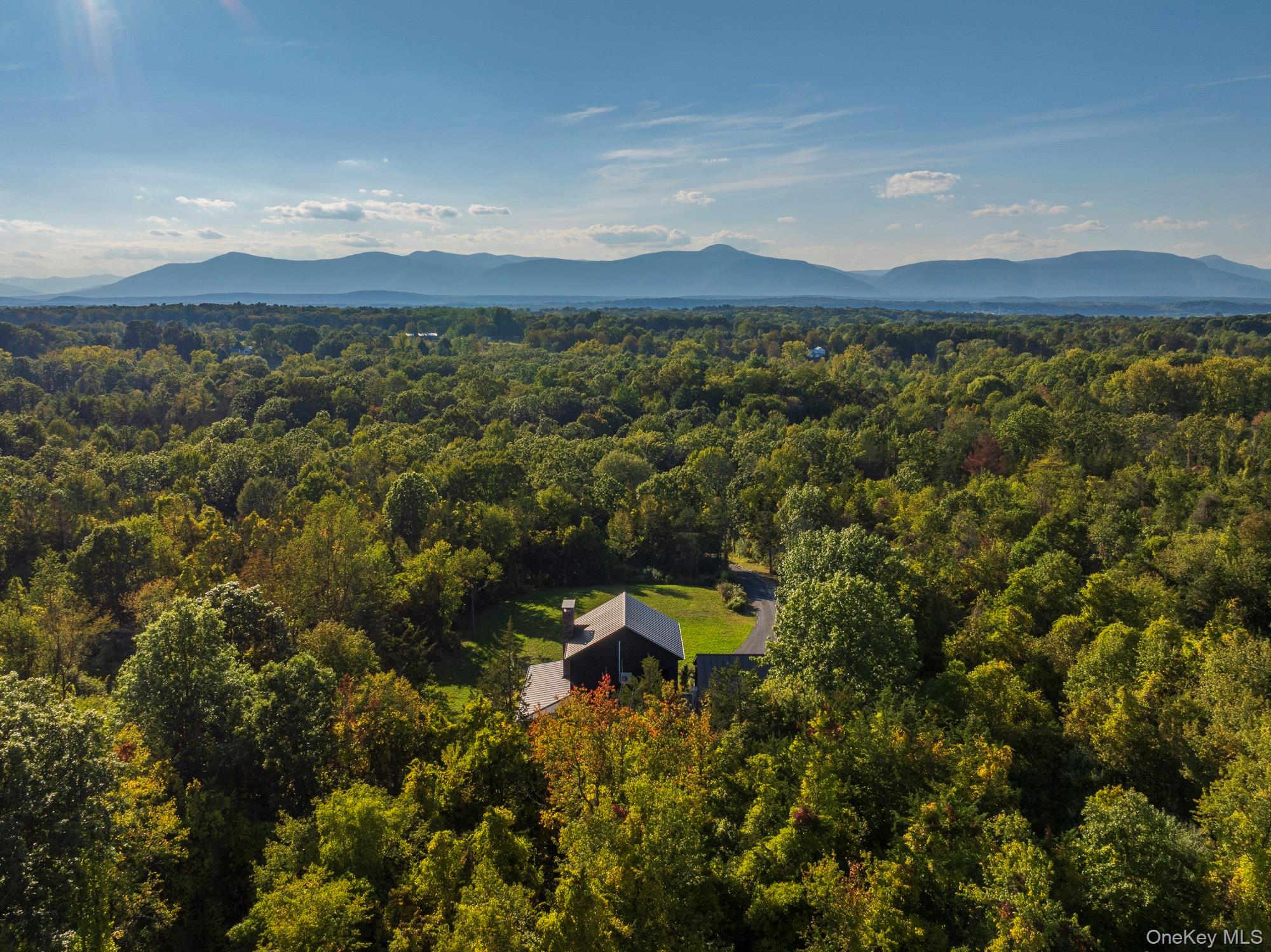 a view of a mountain with a lake in the background