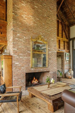 a room with furniture and paintings on wall