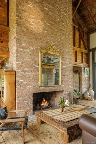 a room with furniture and paintings on wall