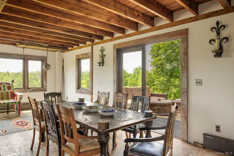 a dining room with furniture and a fireplace