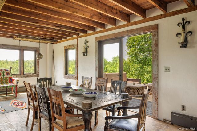 a dining room with furniture and a fireplace