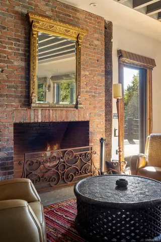 a kitchen with a stove a sink and a dining table