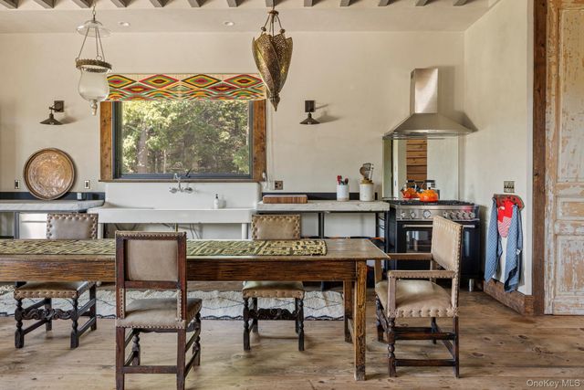 a kitchen with a table and chairs in it