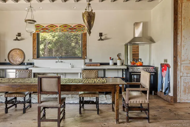 a kitchen with a table and chairs in it